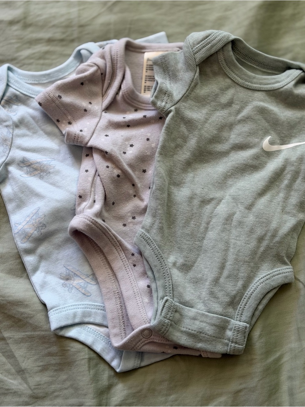 Nike Sage Green Bodysuit with Pastel Blue and Lavender Onesies